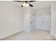 Cozy bedroom with carpet, ceiling fan, and closet doors for storage at 695 S Elm St, Statesville, NC 28677