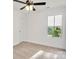 Comfortable bedroom with carpet, ceiling fan, and a window providing natural light at 695 S Elm St, Statesville, NC 28677