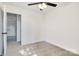 Inviting bedroom with carpet, ceiling fan, and access to an adjacent room at 695 S Elm St, Statesville, NC 28677