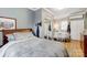 Spacious bedroom with two beds, mirrored closet doors, and a window, offering comfort and functionality at 7201 Cedarfield Rd, Charlotte, NC 28227