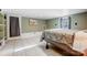 Simple bedroom with tiled floors, a comfortable bed, and an exterior door for easy access to the outside at 7201 Cedarfield Rd, Charlotte, NC 28227