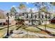 Spacious two-story home with ample windows, a walkout basement, and mature trees at 7201 Cedarfield Rd, Charlotte, NC 28227