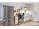 Well-lit kitchen featuring stainless steel appliances, ample cabinet space, and a clean, functional design at 7201 Cedarfield Rd, Charlotte, NC 28227