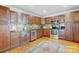 Stylish kitchen featuring wooden cabinets, stainless steel appliances, and a tiled backsplash at 7201 Cedarfield Rd, Charlotte, NC 28227