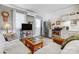 Cozy living room with a TV, comfortable seating, and a convenient kitchen area, ideal for relaxed living at 7201 Cedarfield Rd, Charlotte, NC 28227