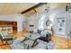 Bright living room boasts hardwood floors, ceiling fans, and an open layout to the kitchen at 7201 Cedarfield Rd, Charlotte, NC 28227