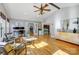 Spacious living room with hardwood floors and a view into the kitchen offers great entertaining space at 7201 Cedarfield Rd, Charlotte, NC 28227