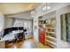 Well-lit office space with hardwood floors, built-in shelving, and a modern desk setup at 7201 Cedarfield Rd, Charlotte, NC 28227