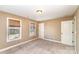 Neutral bedroom featuring carpet, closet, and large windows letting in natural light at 8137 Caliterra Dr, Charlotte, NC 28227