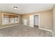 Neutral bedroom featuring carpet, closet, and window letting in natural light at 8137 Caliterra Dr, Charlotte, NC 28227