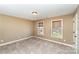 This neutral bedroom features carpet, closet, and large windows letting in natural light at 8137 Caliterra Dr, Charlotte, NC 28227