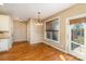 Cozy breakfast nook with hardwood floors and a door leading to the deck at 8137 Caliterra Dr, Charlotte, NC 28227