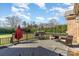 Spacious wooden deck features a grill, umbrella, and outdoor seating area at 8137 Caliterra Dr, Charlotte, NC 28227