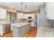 Well-lit kitchen featuring granite countertops, stainless steel appliances, and a center island at 8137 Caliterra Dr, Charlotte, NC 28227