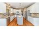 Spacious kitchen featuring granite countertops, stainless steel appliances, and a center island at 8137 Caliterra Dr, Charlotte, NC 28227