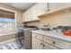Bright laundry room with modern washer and dryer and lots of storage at 8137 Caliterra Dr, Charlotte, NC 28227