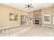 Bright living room with stone fireplace, carpet flooring, and access to other rooms at 8137 Caliterra Dr, Charlotte, NC 28227