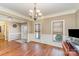 Office space featuring hardwood floors, wainscoting, and natural light at 8137 Caliterra Dr, Charlotte, NC 28227