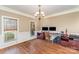 Home office featuring hardwood floors, wainscoting, and two large windows for natural light at 8137 Caliterra Dr, Charlotte, NC 28227