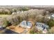 Gorgeous aerial view of gray roof house with an attached garage and landscaping at 8606 Chatsworth Ln, Waxhaw, NC 28173
