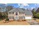 Lovely brick home featuring a two-car garage, manicured lawn, and a welcoming entrance at 8606 Chatsworth Ln, Waxhaw, NC 28173