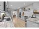 Open kitchen with modern counters, stainless steel appliances, hardwood floors, and bright recessed lighting at 8606 Chatsworth Ln, Waxhaw, NC 28173