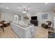 Open living room showcasing neutral paint, recessed lighting, a large sofa, and hardwood floors at 8606 Chatsworth Ln, Waxhaw, NC 28173