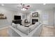 Bright living room featuring recessed lights, a fireplace, hardwood floors, and stylish decor at 8606 Chatsworth Ln, Waxhaw, NC 28173