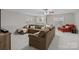 Spacious living room with a plush sectional sofa, windows, and neutral decor at 8606 Chatsworth Ln, Waxhaw, NC 28173
