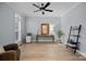 Bright office space with a large window, ceiling fan, and neutral color palette at 8606 Chatsworth Ln, Waxhaw, NC 28173