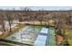 Aerial view of community tennis courts, featuring 4 courts with lights and a green surrounding at 8606 Chatsworth Ln, Waxhaw, NC 28173