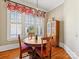 Dining room with hardwood floors and chandelier lighting at 8915 Heydon Hall Cir, Charlotte, NC 28210