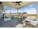 Cozy screened porch with comfortable seating and views of the backyard and neighboring houses at 960 Exeter Dr, Sherrills Ford, NC 28673