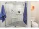 Modern bathroom features a glass-enclosed shower with tiled walls, a shower seat, and neutral colors at 1016 E 10Th St, Kannapolis, NC 28083