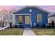 Charming single story home with blue siding, manicured lawn, and a welcoming front porch at 1016 E 10Th St, Kannapolis, NC 28083