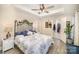 Comfortable main bedroom with a ceiling fan, a decorative headboard, neutral paint and an attached closet at 1016 E 10Th St, Kannapolis, NC 28083