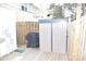 Backyard shed on a wooden deck with a black covered grill, surrounded by a wooden fence at 12742 Spirit Bound Way, Charlotte, NC 28273