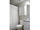 Charming bathroom features granite counter, white cabinets, and stylish shower curtain at 12742 Spirit Bound Way, Charlotte, NC 28273