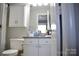 Functional bathroom features a vanity with a granite countertop and updated fixtures at 12742 Spirit Bound Way, Charlotte, NC 28273