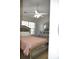 Cozy bedroom features a ceiling fan, window, and silver dresser with a large mirror at 12742 Spirit Bound Way, Charlotte, NC 28273