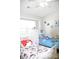 Bright bedroom featuring two beds with vibrant decorations and a large window at 12742 Spirit Bound Way, Charlotte, NC 28273