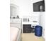 This bedroom includes a modern vanity, dresser, TV, and a sleek design at 12742 Spirit Bound Way, Charlotte, NC 28273