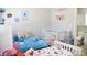 Charming bedroom with two cozy beds, themed decor, and an adjacent bathroom at 12742 Spirit Bound Way, Charlotte, NC 28273