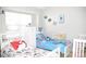 Charming bedroom with two cozy beds, themed decor, and a bright window at 12742 Spirit Bound Way, Charlotte, NC 28273