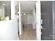 Inviting foyer with wood floors, offering a glimpse into the open-concept living spaces beyond at 12742 Spirit Bound Way, Charlotte, NC 28273