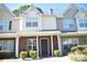 Charming townhouse with a brick facade, covered porch, and well-maintained landscaping at 12742 Spirit Bound Way, Charlotte, NC 28273
