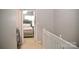 Upstairs hallway view leading to bedroom, plus laundry nook with machines on left at 12742 Spirit Bound Way, Charlotte, NC 28273
