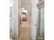 Bright hallway leading to a bedroom and bathroom, promoting a sense of flow at 12742 Spirit Bound Way, Charlotte, NC 28273