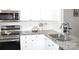 Modern kitchen with stainless steel appliances, granite countertops and white subway tile backsplash at 12742 Spirit Bound Way, Charlotte, NC 28273