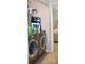 Laundry area with modern washer and dryer machines near bedroom entrance at 12742 Spirit Bound Way, Charlotte, NC 28273